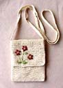 Handcrafted accessory manufacturer distributes wholesale Crochet styled summer purse with flower embroidery design