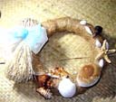 Handmade beach wreath with seashells decorating woven circle from online China import outsourcing agency